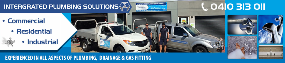 Intergrated Plumbing Solutions team with work vehicles